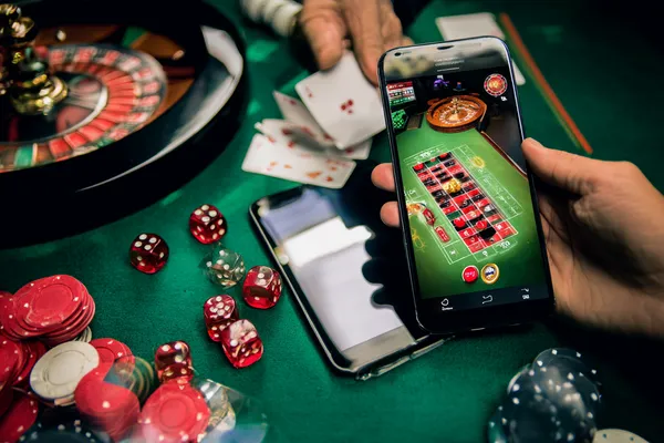A person using their device against a moody casino-themed background, illustrating the smooth re-entry process at FFBETT.